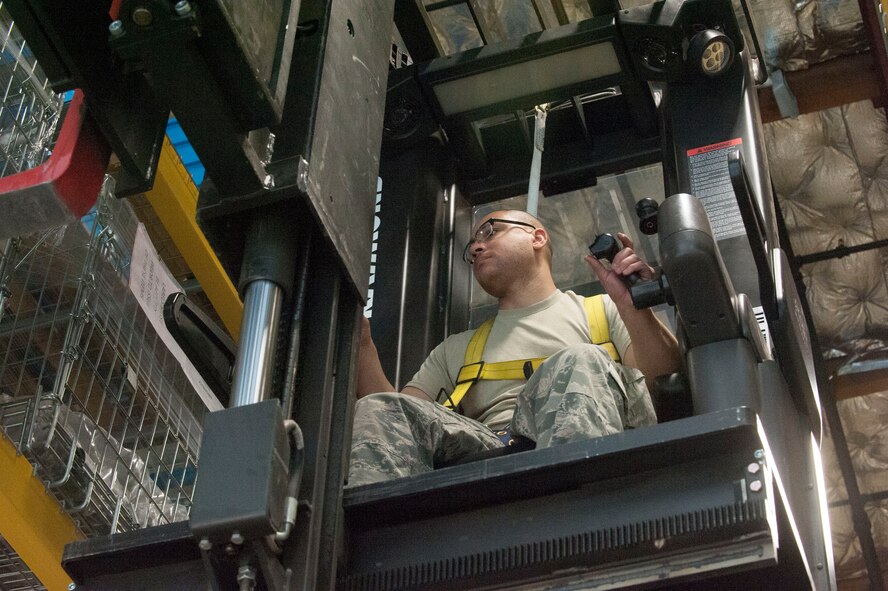 Staff Sgt. Micheal Heger, 92nd Logistics Readiness Squadron individual protective equipment supervisor, operates a Raymond 3K stock picker while taking inventory March 26, 2015, at Fairchild Air Force Base, Wash. Inventories are conducted monthly and as needed for shelf-life assets. Expiration dates on shelf items are tracked in a database and checked daily to ensure they are serviceable. (U.S. Air Force photo/Staff Sgt. Samantha Krolikowski)