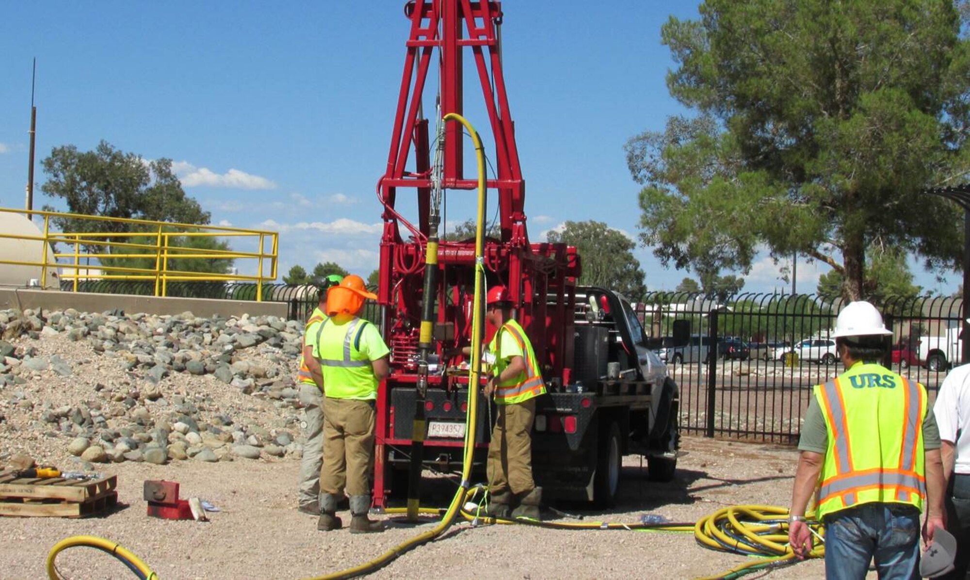 JOINT BASE SAN ANTONIO-LACKLAND, Texas - An environmental restoration crew lowers an injection tool into a well as part of the environmental hydrofracturing process. The technology creates small underground cracks into which a slurry of sand, soy beans, laundry detergent, nutrients and micro-organisms will be injected to accelerate removal of contamination previously trapped in dense soils around Air Force Plant 44 in Tucson, Arizona. (Courtesy Photo)