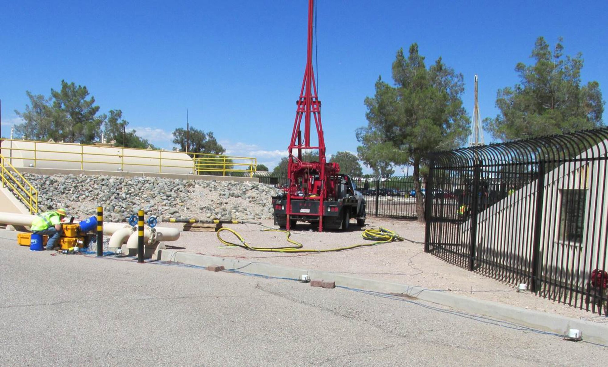 JOINT BASE SAN ANTONIO-LACKLAND, Texas - An environmental restoration crew sets up a telemetry system to measure vibrations around an environmental hydrofracturing injection well. Environmental hydrofracturing is being used to accelerate cleanup at Air Force Plant 44 in Tucson, Arizona, by creating small underground cracks that will enable removal of contamination previously trapped in dense soils. (Courtesy Photo)