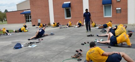 Drew Stallard, Navy Command fitness leader instructor, teaches participants of the Command Fitness Leader certification course regeneration techniques at Sam's Fitness Center on the Weapons Station, March 26, 2015. Navy personnel assigned to Joint Base Charleston, as well some from out of state, attended the Command Fitness Leader certification course to become qualified to serve as CFLs. The course allows the Navy personnel to conduct the Navy Physical Fitness Assessment for their unit, advise the chain of command on a Physical Readiness Program, provide oversight on command physical training and maintain physical fitness related documentation for the command. The weeklong certification training consisted of classroom briefs, gym sessions and a practical exercise. The training is offered three to four times a year through Sam’s Fitness Center on the Weapons Station. (Courtesy photo)
