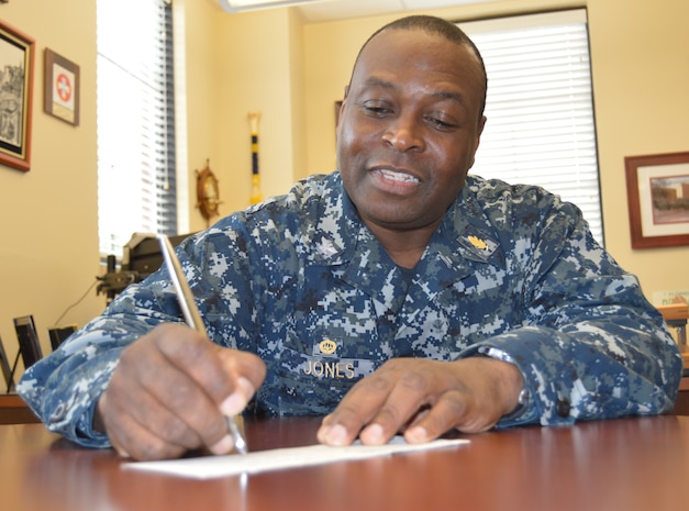 Naval Health Clinic Charleston Commanding Officer Capt. Marvin Jones signs a donation form for the Navy and Marine Relief Corps Society fund drive March 25, 2015 at the clinic. NMCRS was established in 1904 to aid Sailors and Marines in urgent financial need. Through donations, the Navy-marine Corps Relief Society may be able to provide an interest-free loan or grant. In an emergency, the Society can provide assistance for basic living needs, such as food, rent, and utilities; essential vehicle repairs; emergency travel;
disaster relief and funeral assistance. The Society also has caseworkers to provide financial counseling to help service members plan for better financial stability. Visit www.nmcrs.org for more information. (U.S. Navy photo / Kris Patterson)