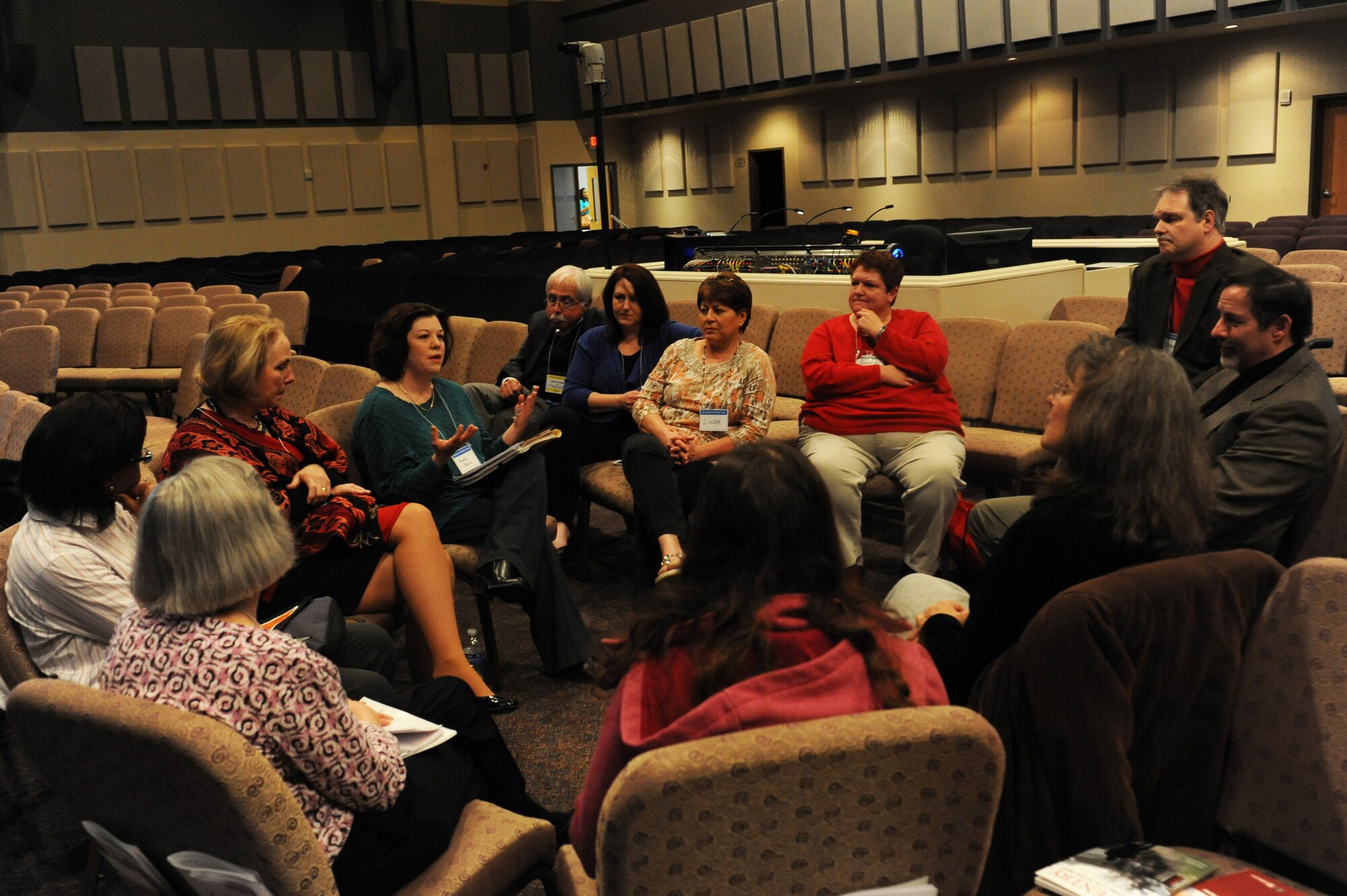 Military members, veterans and families talk during a break out session during the No Family Left Behind Conference at Faith Family Church March 14, 2014. The 2nd annual NFLBC is going to be April 24 and 25, 2015. This conference is designed to help people with mental health problems and give them resources. (U.S Air Force photo by Airman 1st Class Megan Friedl)