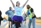 Senior Airman Alana Dadlez, 11th Comptrollers Squadron permanent change of station team lead, runs during the Run with Color 5k on Joint Base Andrews, Md., April 1, 2015. The JBA Sexual Assault Prevention and Response program hosted the 5K to kick-off Sexual Assault Awareness Month. (U.S. Air Force photo/ Senior Airman Nesha Humes)