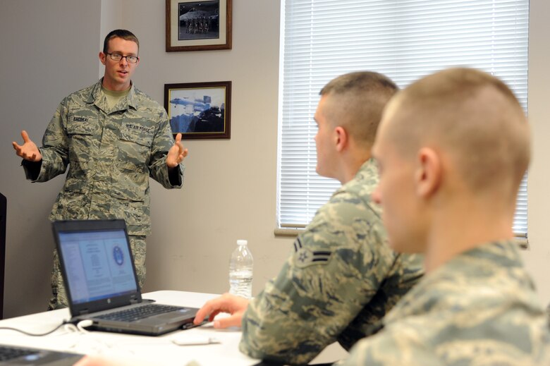 Tech. Sgt. Ryan Bacskai, 372nd Training Squadron Detachment 27 maintenance instructor, leads a class on the fuel system of the RQ-4 Global Hawk on Grand Forks Air Force Base, N.D., April 1, 2015. Bacskai was selected as the Grand Forks AFB Warrior of the Week for the first week of April 2015. (U.S. Air Force photo by Staff Sgt. David Dobrydney/Released)
