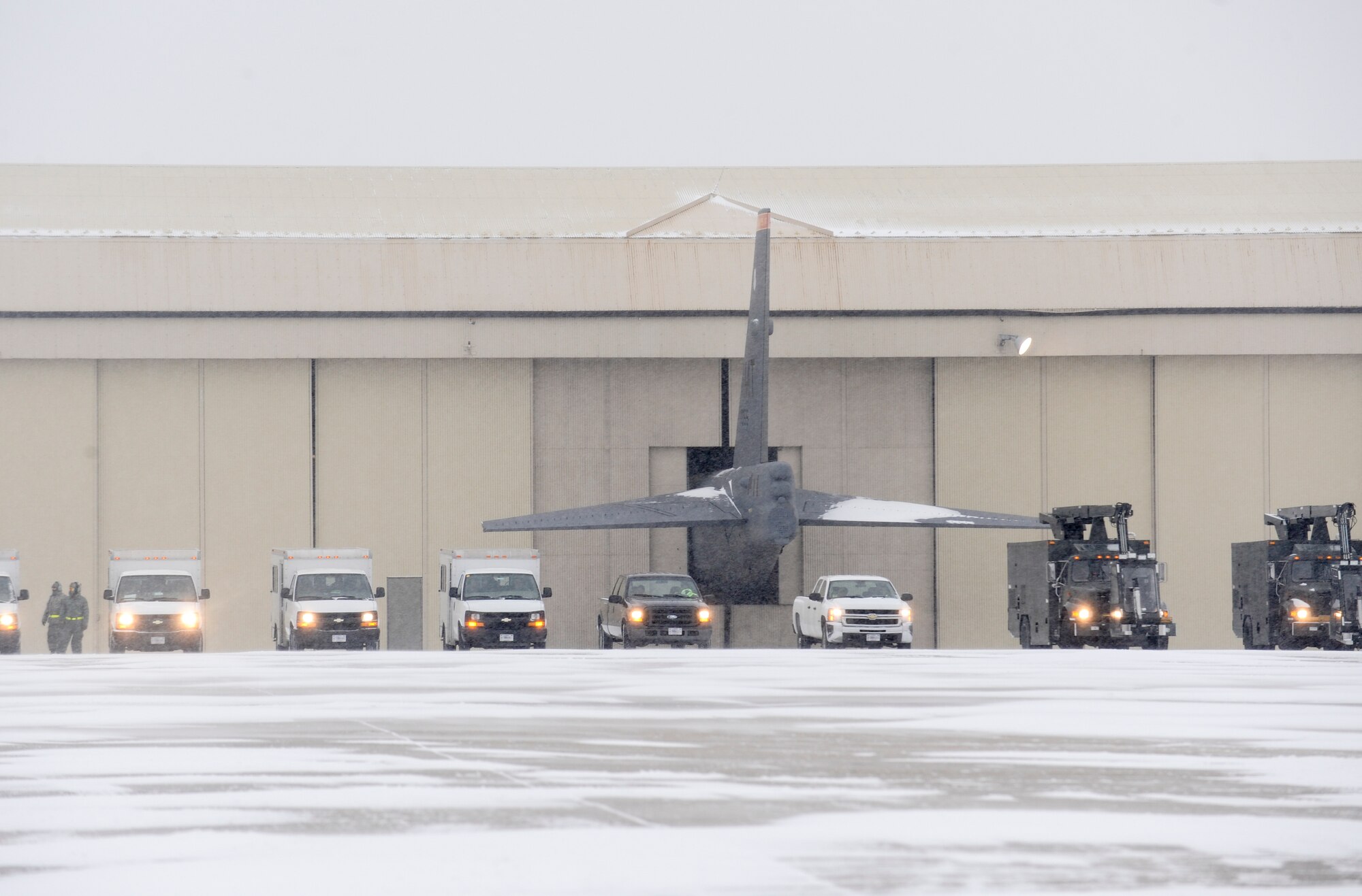 Maintenance vehicles sit in a row on the flightline during a rapid launch exercise on Minot Air Force Base, N.D., March 27, 2015. Maintenance Airmen worked side-by-side with fire department and security forces personnel to ensure the exercise was a success. (U.S. Air Force photo/Senior Airman Stephanie Morris)