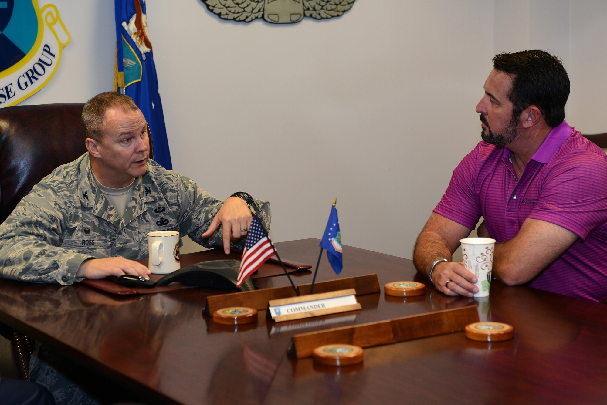 U.S. Air Force Col. Michael Ross, 820th Base Defense Group commander, talks to Dr. Howard Wasdin, former Navy SEAL Team Six member, March 27, 2015, at Moody Air Force Base, Ga. Ross explained the 820th BDG mission to Wasdin. (U.S. Air Force photo by Airman 1st Class Kathleen D. Bryant/Released)