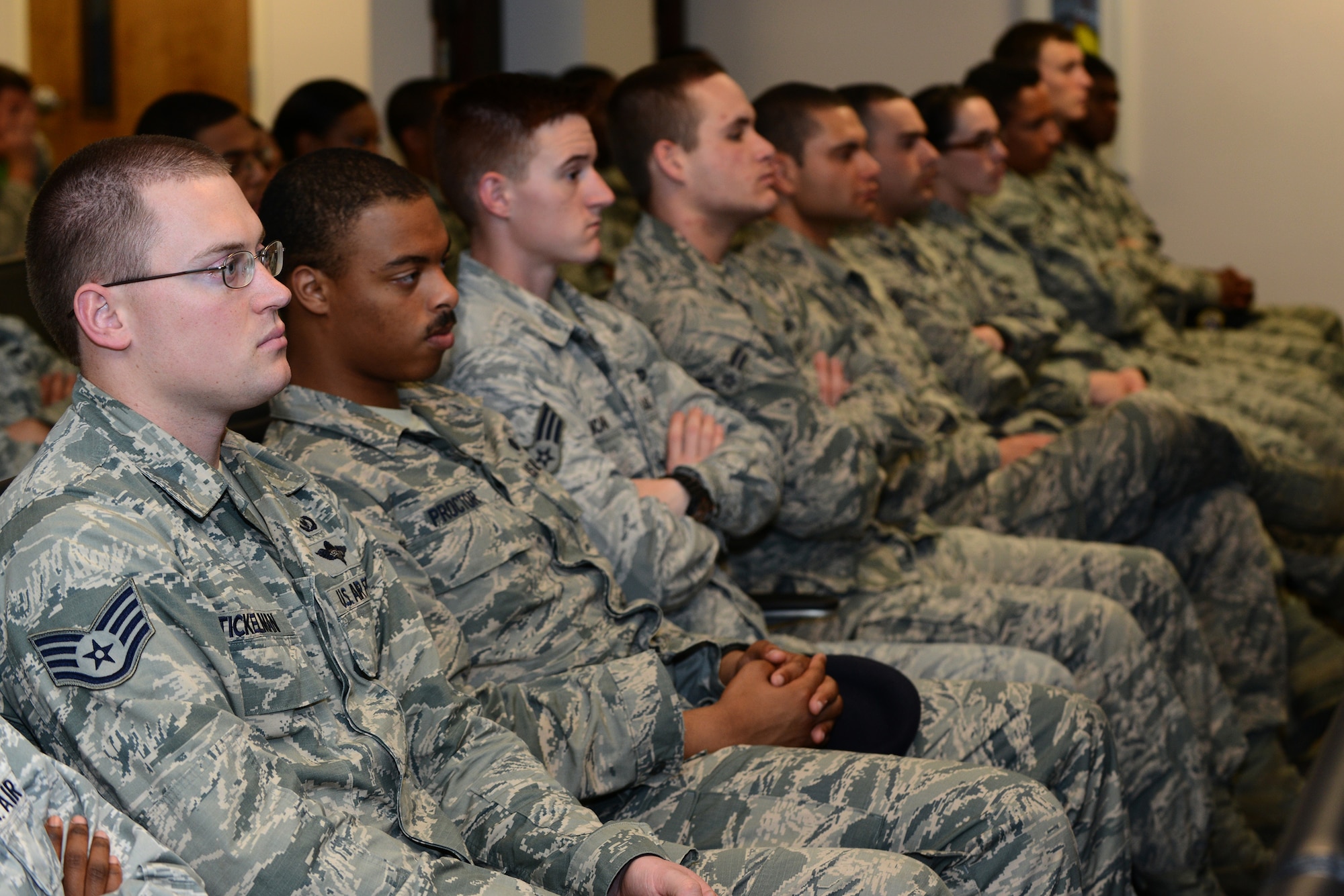 Airmen from the 820th Base Defense Group listen to Dr. Howard Wasdin, a former Navy SEAL Team Six member, talk about his experiences March 27, 2015, at Moody Air Force Base, Ga. Wasdin talked about saving a Somalian child during his time as a SEAL. (U.S. Air Force photo by Airman 1st Class Kathleen D. Bryant/Released)