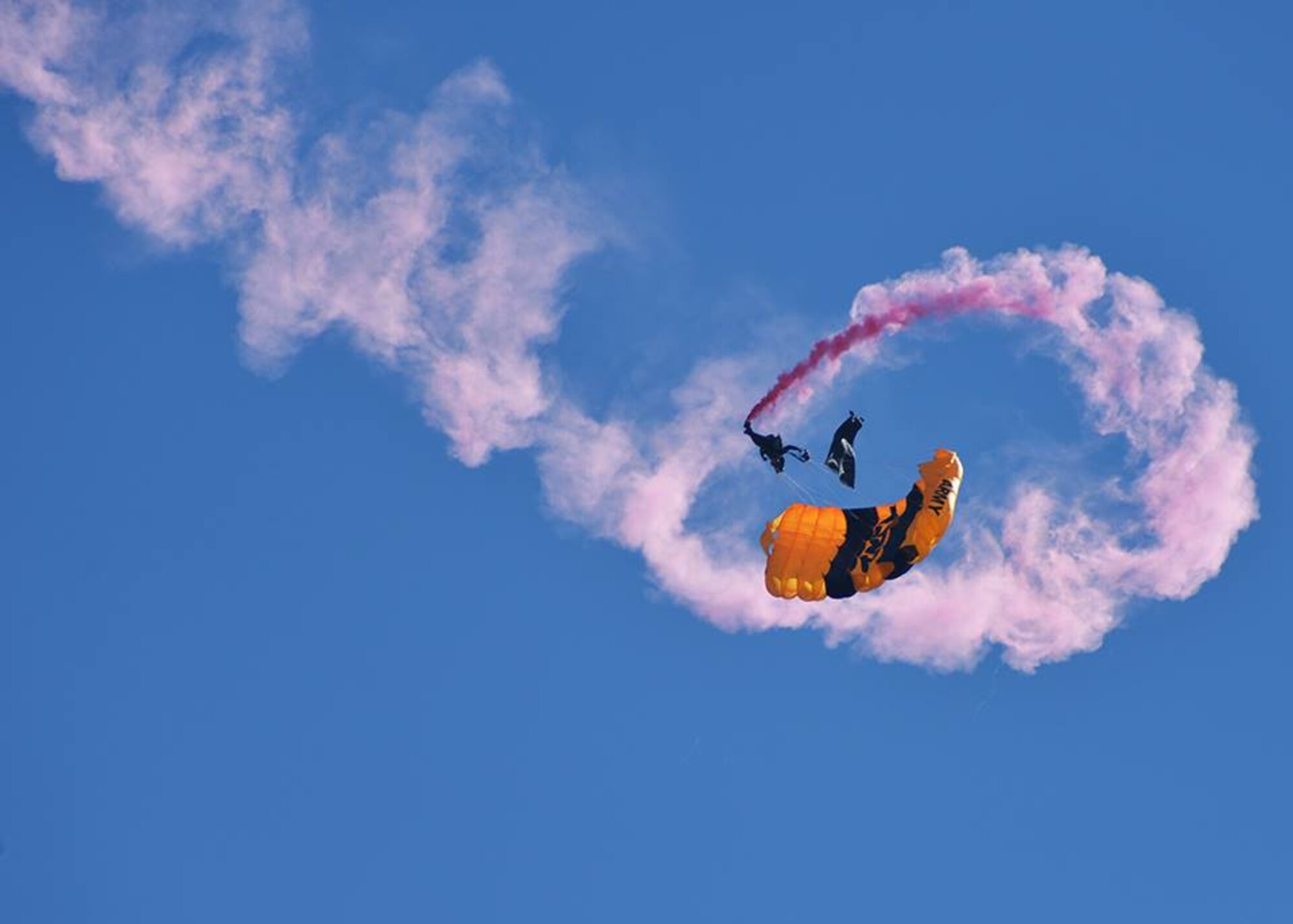 A member of the U.S. Army Parachute Team, the Golden knights, performs a stunt during the Keesler Air Force Base, Miss. Thunder Over the Bay Air Show March 28. The Golden Knights are scheduled to perform at Tyndall’s Gulf Coast Salute Open House and Air Show April 11 and 12. (U.S. Air Force photo by Tech. Sgt. Javier/Released)
