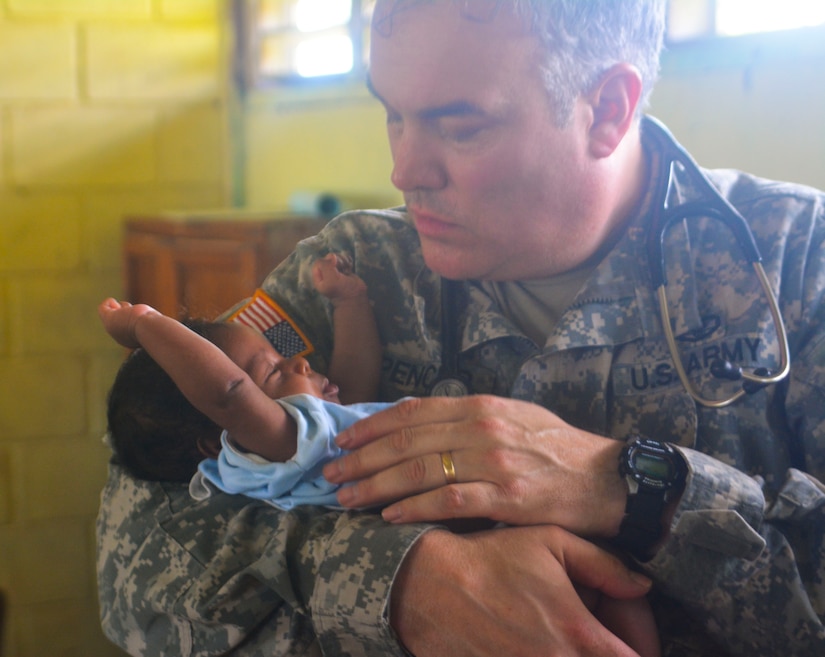 U.S. Army Col. Steven Spencer provides a medical screening for a Honduran child during a Medical Readiness Training Exercise in the Department of Gracias a Dios, Honduras. March 24, 2015. Joint Task Force-Bravo’s Medical Element provided medical care to more than 970 Honduran citizens during the two day MEDRETE operation. (Photo by U.S. Army Staff Sgt.  Jason Tedesco)
