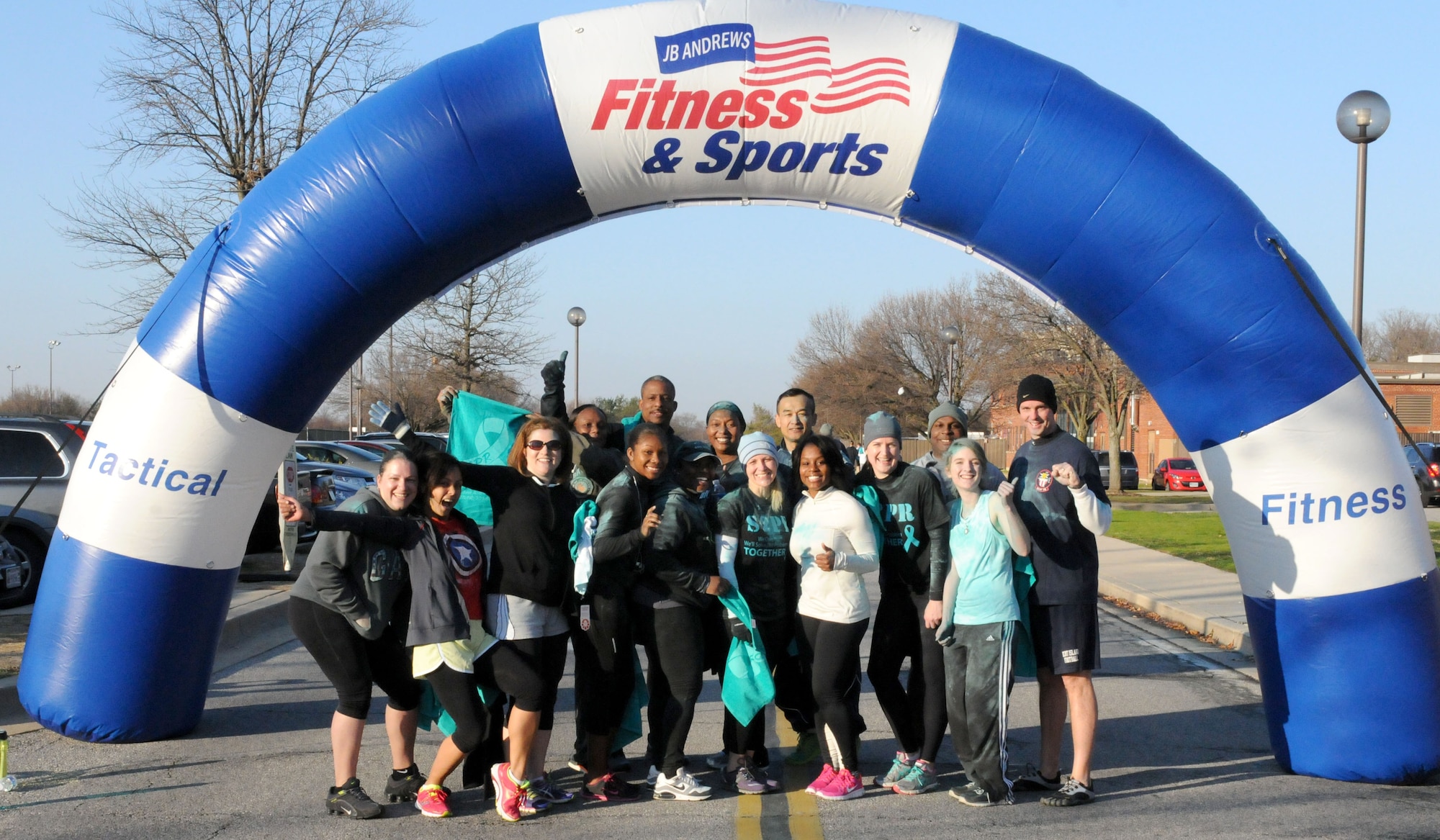 D.C. Air National Guard members stand at the finish line after running in the Joint Base Andrews Sexual Assault Awareness and Prevention Month 5K Color run Apr. 1, 2015.  The DCANG "Capital Guardians" supported the event to raise awareness of sexual assault in the military and help eliminate it once and for all.  (Air National Guard photo by Master Sgt. Craig Clapper)