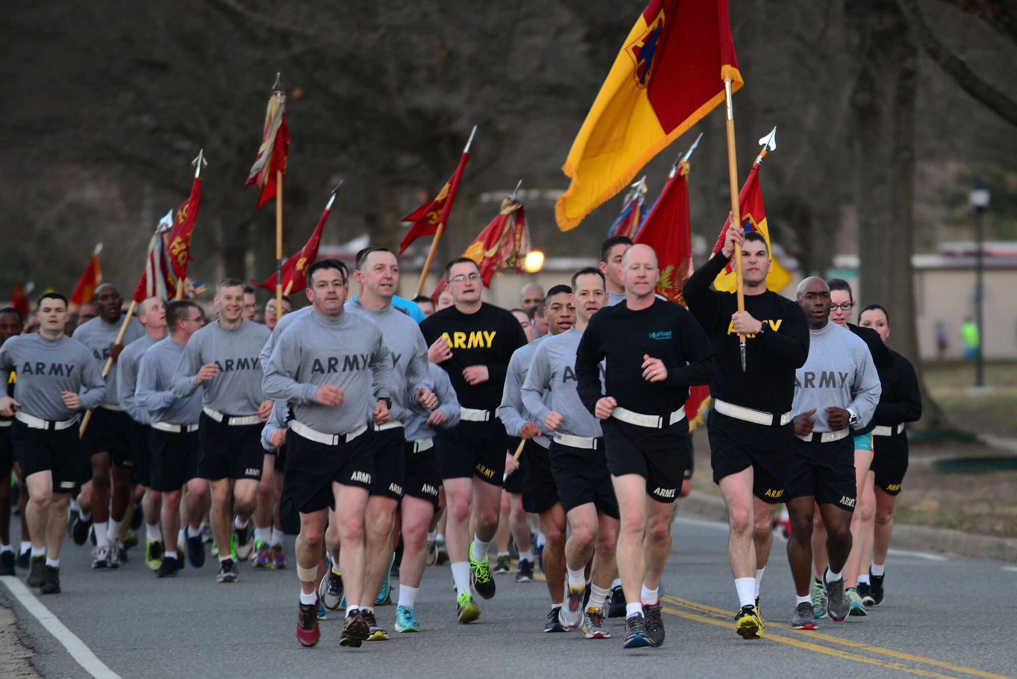 U.S. Army Col. Randal Nelson, 7th Transportation Brigade (Expeditionary) commander, leads the brigade in the Sexual Assault Awareness and Prevention Month 5K run at Fort Eustis, Va., April 1, 2015. The run was just one of the events that Joint Base Langley-Eustis will be hosting this month including a sexual assault awareness fair, a rally and a meet your victim advocate day. (U.S. Air Force photo by Senior Airman Kimberly Nagle/Released)