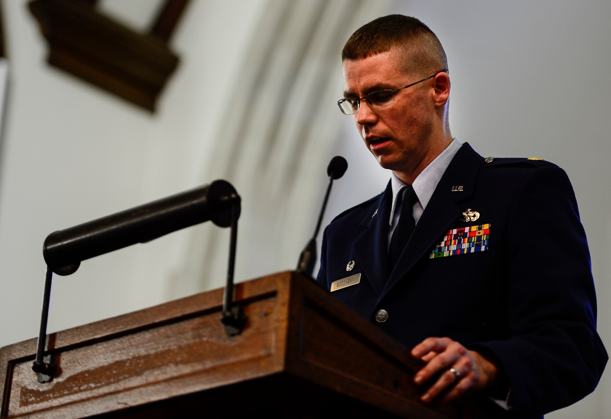 U.S.  Air Force Maj. Gregory Boschert, 633rd Logistics Readiness Squadron commander, addresses an audience during a memorial service at Langley Air Force Base, Va., March 24, 2015. Members of Joint Base Langley-Eustis gathered to honor the life of Airman 1st Class Zachary Wolfe of the 633rd LRS. (U.S. Air Force photo by Senior Airman Kayla Newman/Released)