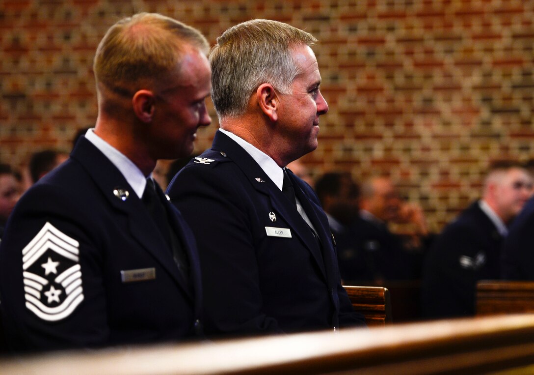U.S. Air Force Col. John J. Allen Jr., 633rd Air Base Wing commander, and Chief Master Sgt. Mark Hurst, 633rd ABW command chief, attend a memorial service for Airman 1st Class Zachary Wolfe at Langley Air Force Base, Va., March 24, 2015. Wolfe was a member of the 633rd Logistics Readiness Squadron and passed away March 17, 2015. (U.S. Air Force photo by Senior Airman Kayla Newman/Released)