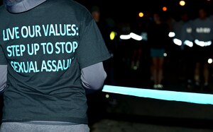A Fort Eustis Victim Advocate holds the starting line before the Sexual Assault Awareness and Prevention Month 5K kick-off event at Fort Eustis, Va., April 1, 2015.  SAAPM provides commanders an opportunity to take stock in how far they have come in the fight against sexual assault and domestic violence in the U.S. Army and continue the focus on prevention. (U.S. Air Force photo by Senior Airman Kimberly Nagle/Released)