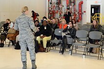 Tech. Sgt. Nalopa Hansen, 627th Force Support Squadron readiness NCO in charge, speaks to a group of spouses during a recent Servicemember and Family Readiness Center Deployment Fair on Joint Base Lewis-McChord, Wash. The S&FRC Deployment Fairs provide spouses of deployed personnel with information about services designed to help them through the deployment. (U.S. Air Force photo/Senior Airman Rebecca Blossom)