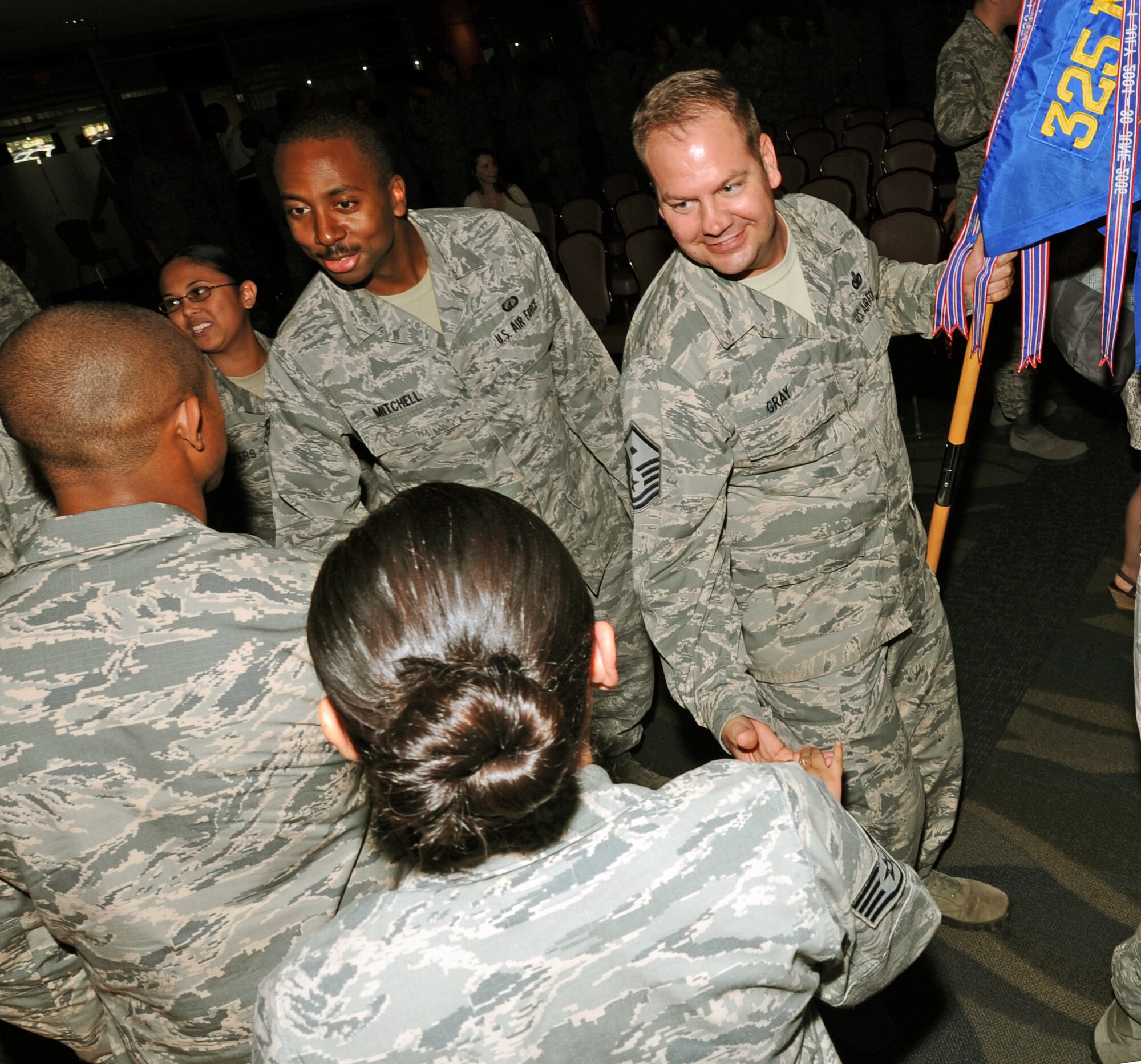 Tyndall’s newest promotees receive congratulatory handshakes at the April promotion ceremony March 31 at the Horizon’s Ballroom. The monthly promotion ceremony honors those Airmen receiving a new rank. (U.S. Air Force photo by Airman 1st Class Ty-Rico Lea/Released)