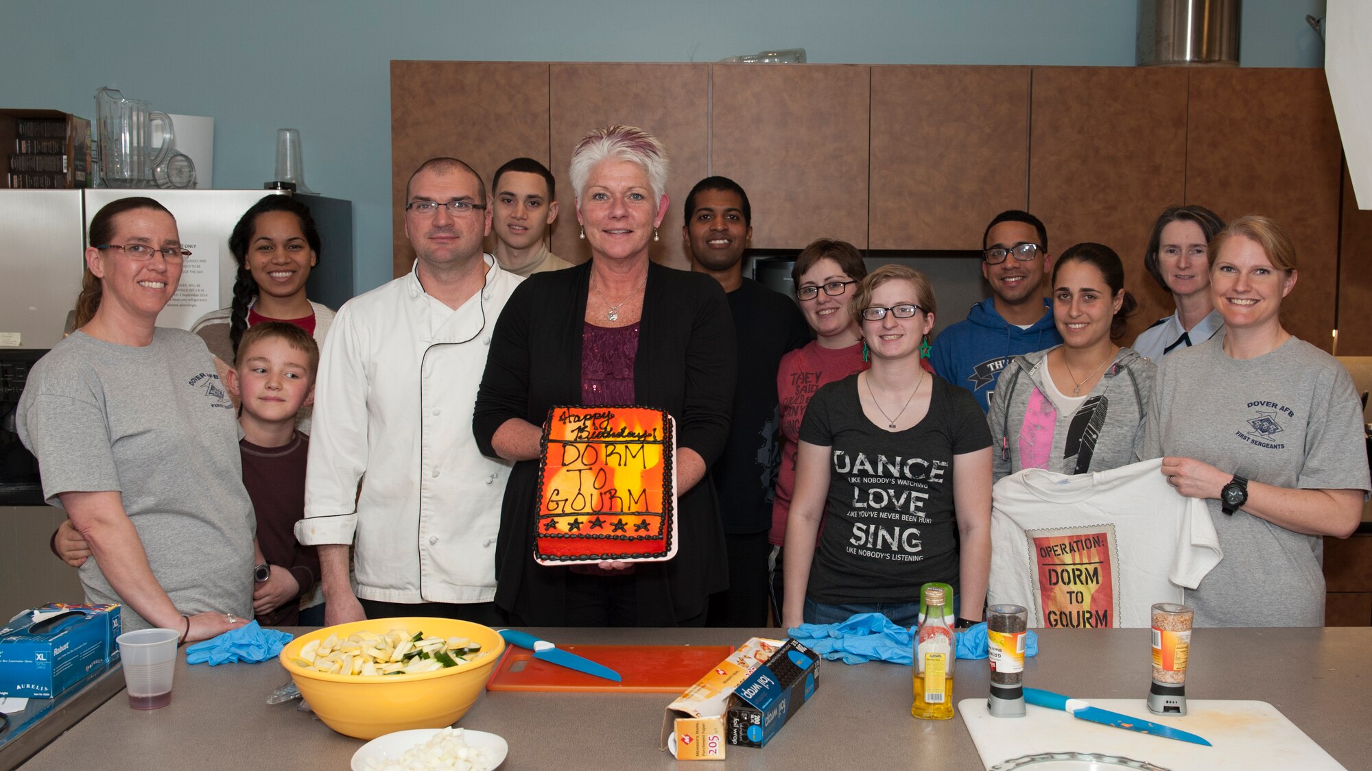 “Dorm to Gourm” class participants pose for a group shotMarch 31, 2015, at Dover Air Force Base, Del. This session was the one year anniversary of the “Dorm to Gourm” Leadership Pathways class. (U.S. Air Force photo/Airman 1st Class Zachary Cacicia)