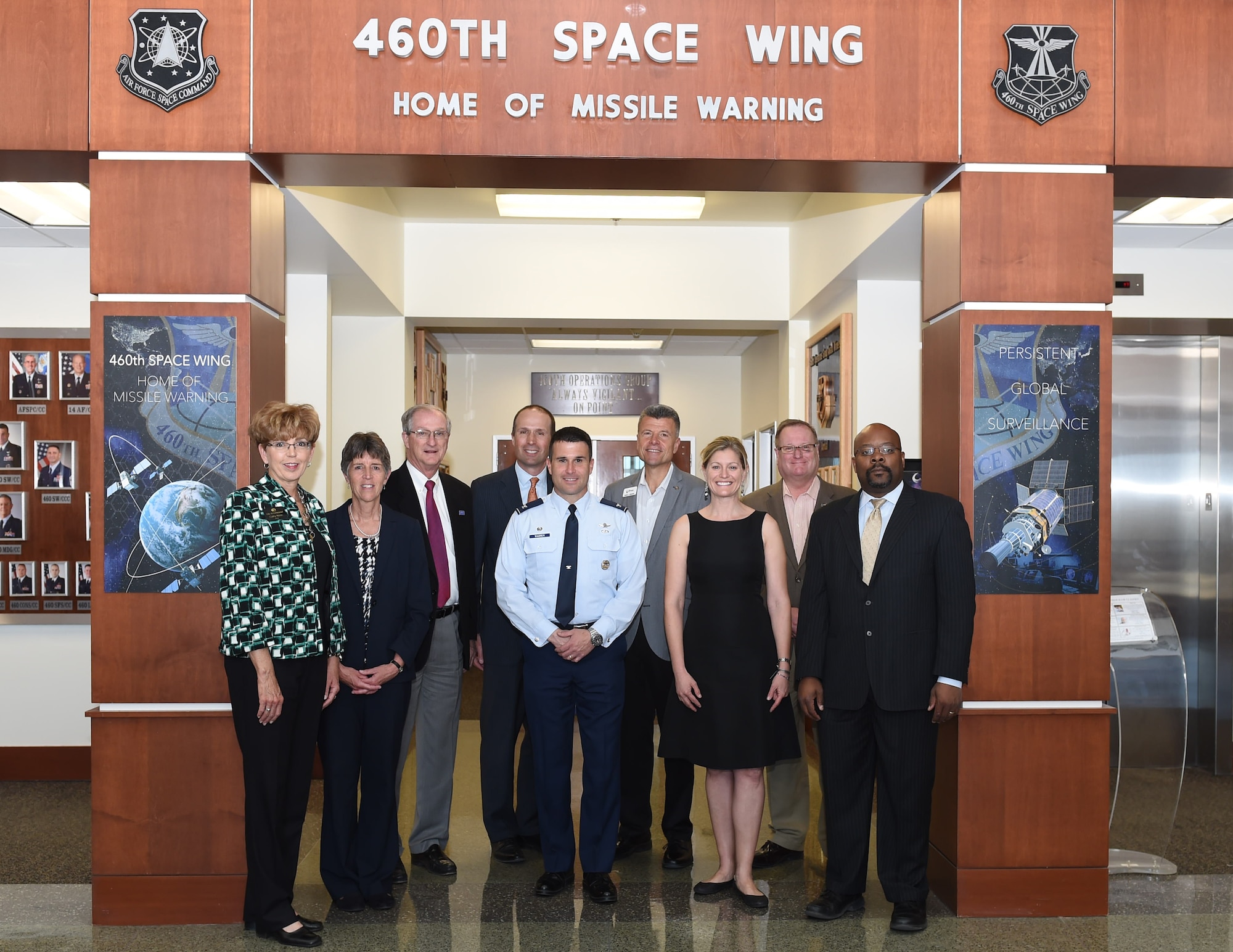 Team Buckley and local community leaders pose for a photo March 31, 2015, in the lobby of the 460th Space Wing Headquarters building on Buckley Air Force Base, Colo. The leaders were gathered together to sign the Buckley Partnership Steering Group charter. The document declares partnerships and collaboration between Buckley AFB and local communities. (U.S. Air Force photo by Airman 1st Class Samantha Saulsbury/Released)

