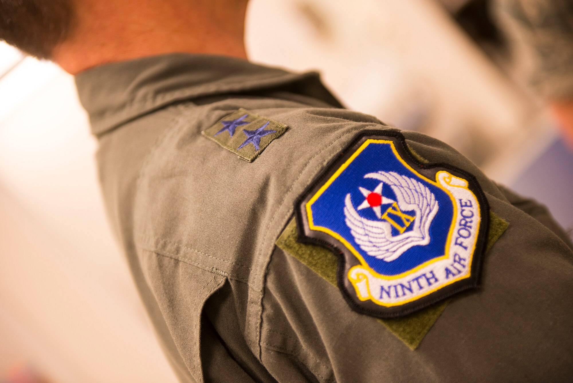U.S. Air Force Maj. Gen. H. D. Polumbo, Jr., Ninth AF commander, listens during a brief March 27, 2015, at Moody Air Force Base, Ga. Base leadership briefed Polumbo on the relationship established with the Jacksonville Naval Station and the benefits the program provides to Airmen. (U.S. Air Force photo by Airman 1st Class Ceaira Tinsley/Released)