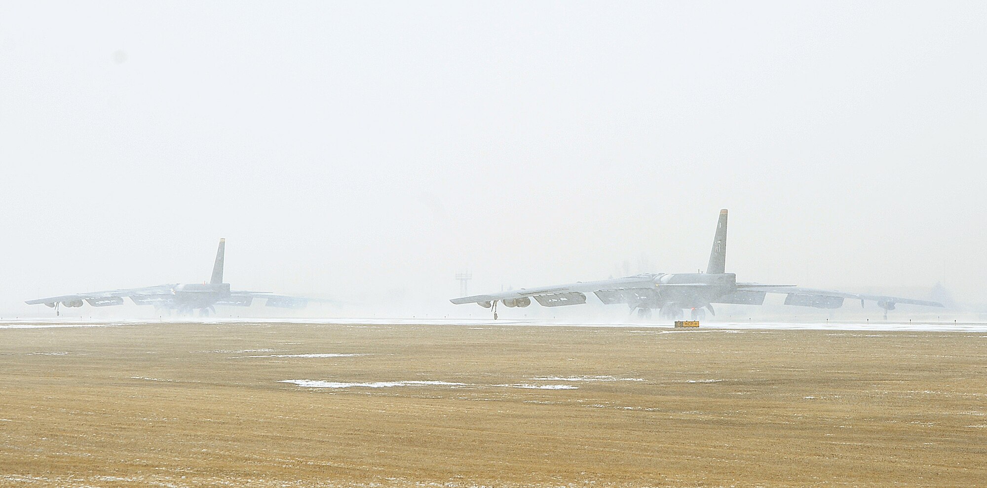 A pair of B-52H Stratofortresses taxi toward the runway during the Prairie Vigilance exercise on Minot Air Force Base, N.D., March 27, 2015. A sequence of B-52s successfully launched during a rapid launch exercise which confirmed the Air Force’s agile ability to respond when called upon. (U.S. Air Force photo/Senior Airman Kristoffer Kaubisch)