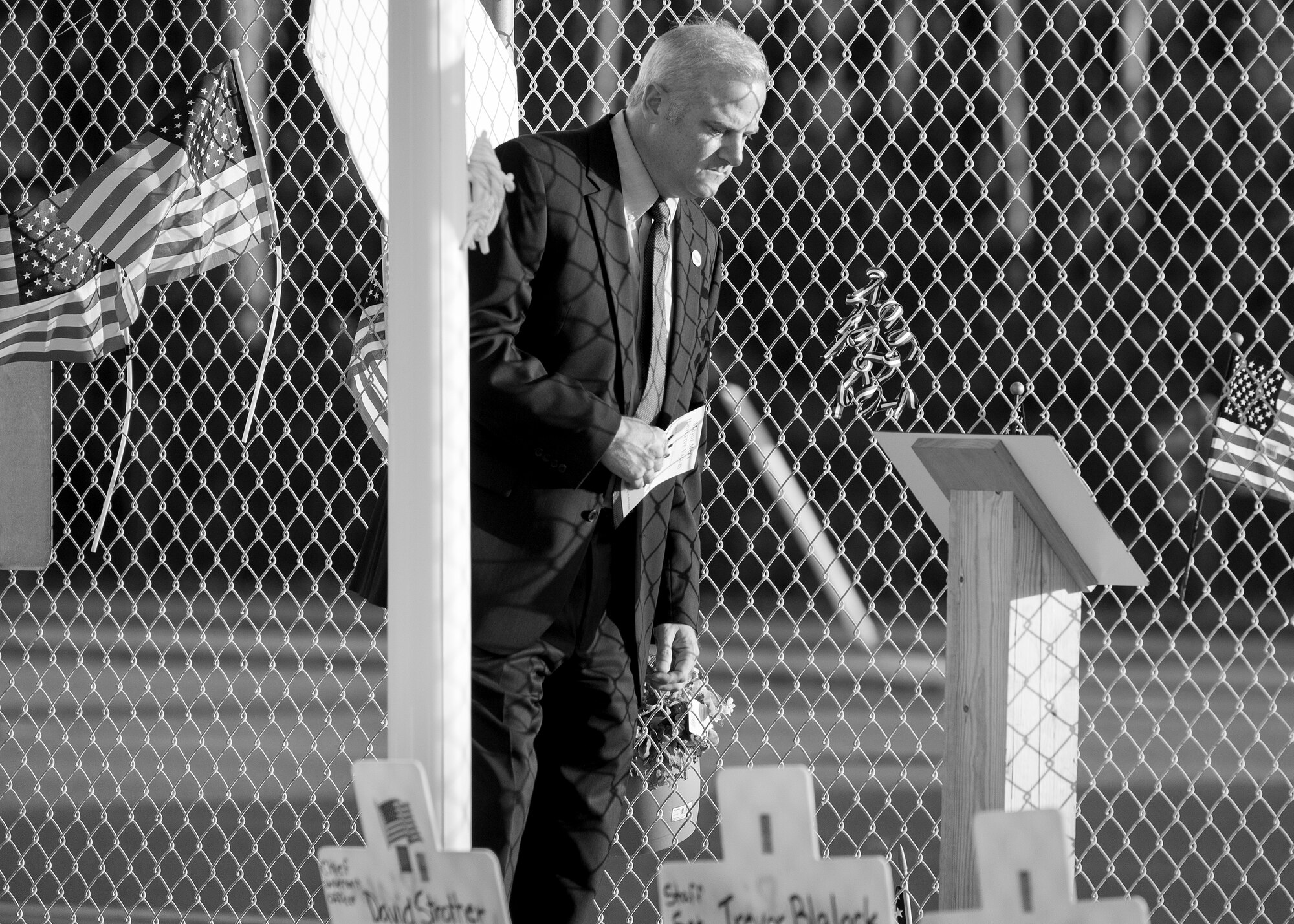 Mayor Mel Ponder of Destin checks out the new flag pole and plaque in memory of the fallen servicemen during the Black Hawk UH-60 memorial service March 31 at Destin Executive Airport, Fla.  Approximately 200 from the Destin community held a candlelight memorial service honoring the fallen servicemen in the helicopter crash in Santa Rosa Sound on March 11. (U.S. Air Force photo/TSgt. Jasmin Taylor)