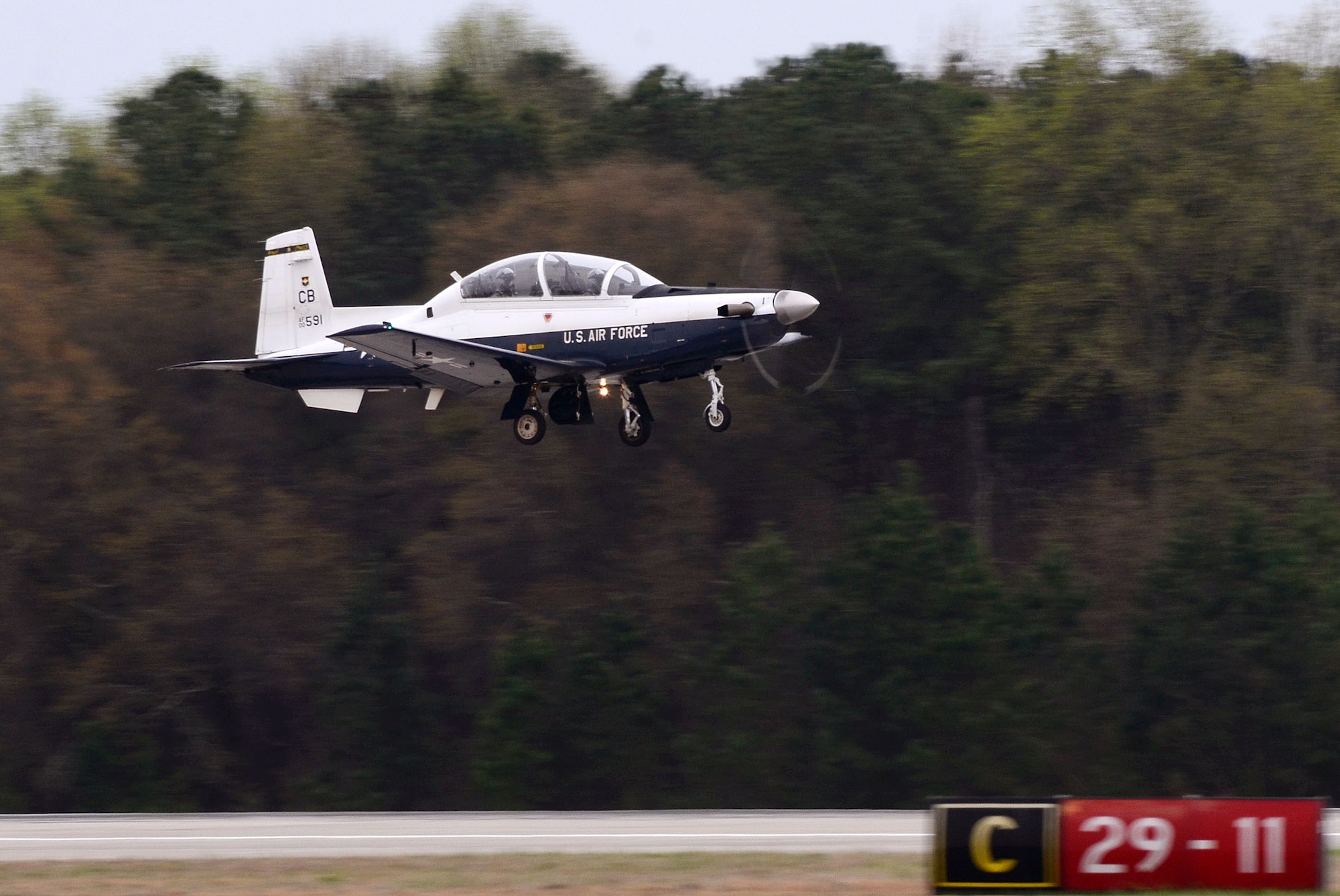Capts. Dwayne L. Booker II and Brandon Jones, 14th Flying Training Wing instructor pilots, take off from Dobbins Air Reserve Base, Georgia, in a T-6 aircraft after attending the first-ever Morehouse College Joint-Service Military Crown Forum March 26 in Atlanta, Georgia. The forum, a student-led event, was derived from the vision of the Morehouse ROTC Joint-Services Committee and Crown Forum committee members. (U.S. Air Force photo/Don Peek)