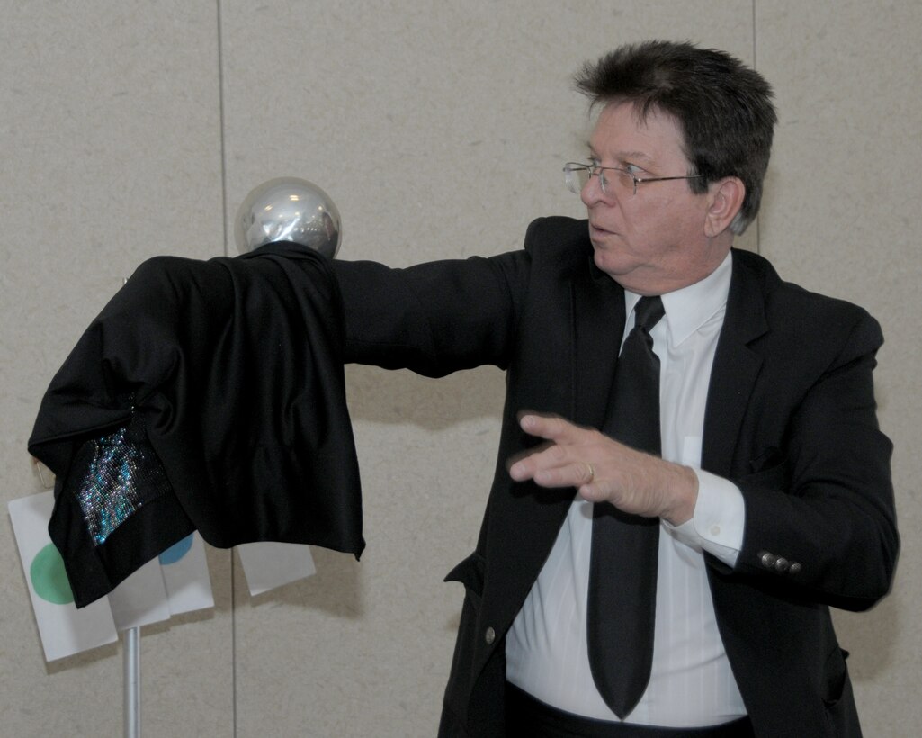Rob Allen performs his magic for a captive audience during the magic show portion of the Easter event held inside the Heritage Center on March 28, 2015. The Niagara Falls Air Reserve Station Friends of Family Support made possible this very entertaining event for the children of military, civilian, retirees and their guests. Events included: an Easter breakfast, crafts, magic show, and of course the egg hunt. (U.S. Air Force photo by Peter Borys)