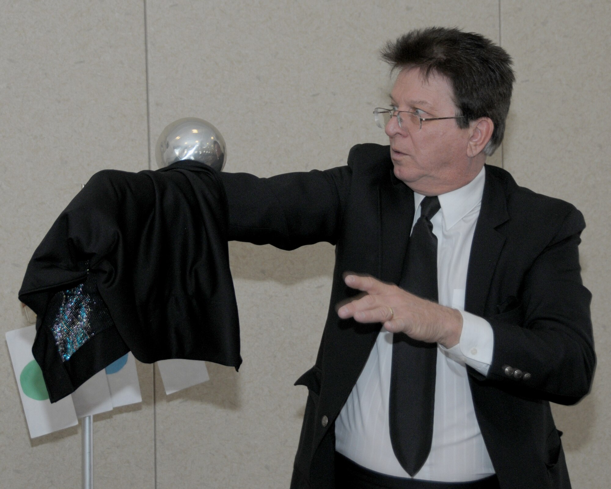 Rob Allen performs his magic for a captive audience during the magic show portion of the Easter event held inside the Heritage Center on March 28, 2015. The Niagara Falls Air Reserve Station Friends of Family Support made possible this very entertaining event for the children of military, civilian, retirees and their guests. Events included: an Easter breakfast, crafts, magic show, and of course the egg hunt. (U.S. Air Force photo by Peter Borys)