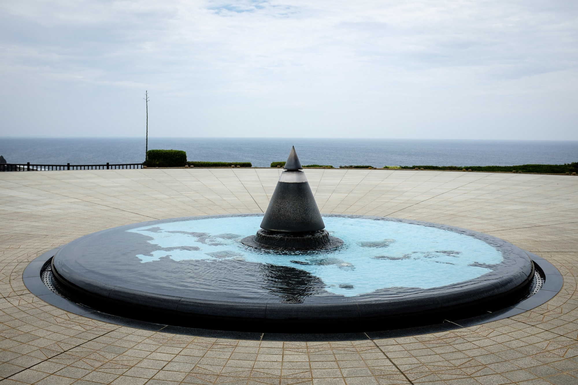 The Eternal Flame sits in the center of a pool of water and map depicting the Pacific region located on the grounds of the Okinawa Prefectural Peace Memorial Museum in Itoman City, Okinawa. The flame is part of a larger monument called The Cornerstone of Peace, which has more than 240,000 names etched in stone of those who died in the Battle of Okinawa. (U.S. Air Force photo by Tech. Sgt. Alexy Saltekoff)