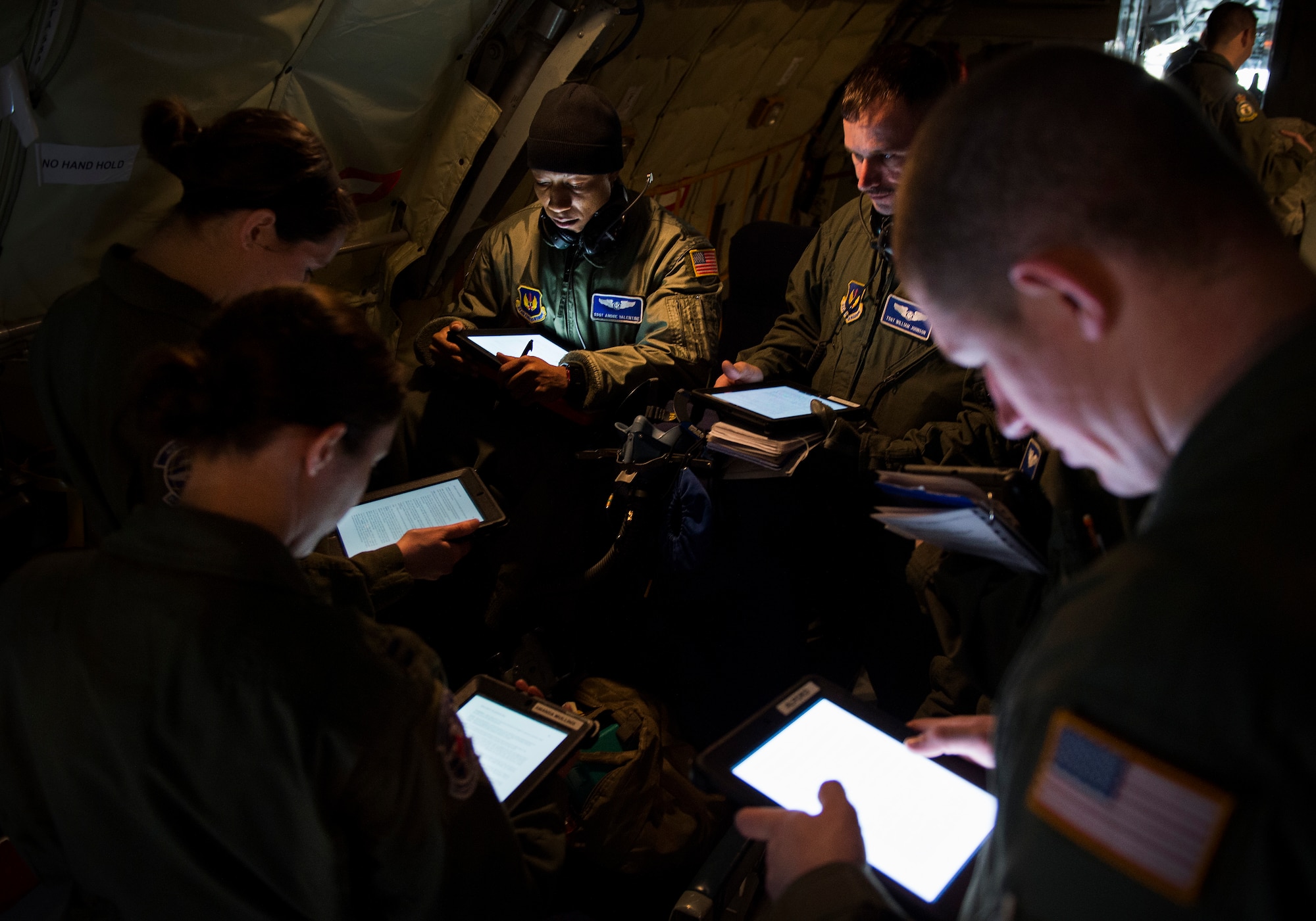 Airmen of the 86th Aeromedical Evacuation Squadron review procedures for loading medical equipment and personnel into a KC-135 Stratotanker at Ramstein Air Base, Germany, March 26, 2015. Aircrew and a KC-135 from Royal Air Force Mildenhall, England, spent multiple days at Ramstein performing aerial refueling missions, which also gave AES Airmen the opportunity to train on their mission inside a different airframe. In addition to setting up medical equipment and treating “patients,” the AES Airmen also familiarized themselves with the KC-135. This included learning where all emergency exits and equipment is located on board in case something goes wrong, and they must evacuate themselves and their patients from the aircraft. (U.S. Air Force photo/Senior Airman Damon Kasberg)