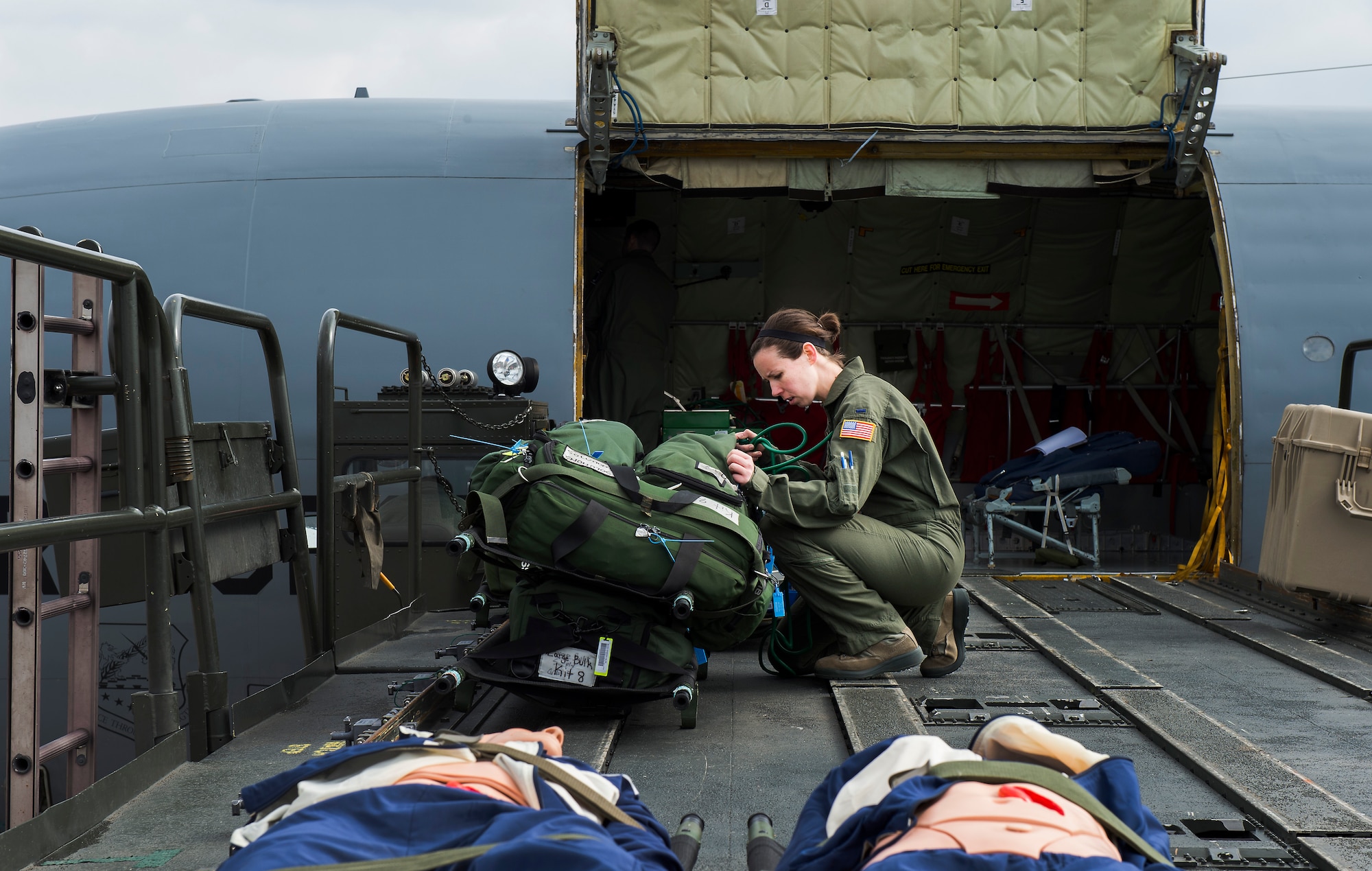 First Lt. Asha Wyatt, 86th Aeromedical Evacuation Squadron flight nurse, removes medical equipment from a bag during training at Ramstein Air Base, Germany, March 26, 2015. Aircrew and a KC-135 Stratotanker from Royal Air Force Mildenhall, England, spent multiple days at Ramstein performing aerial refueling missions, which also gave AES Airmen the opportunity to train on their mission inside a different airframe. (U.S. Air Force photo/Senior Airman Damon Kasberg)