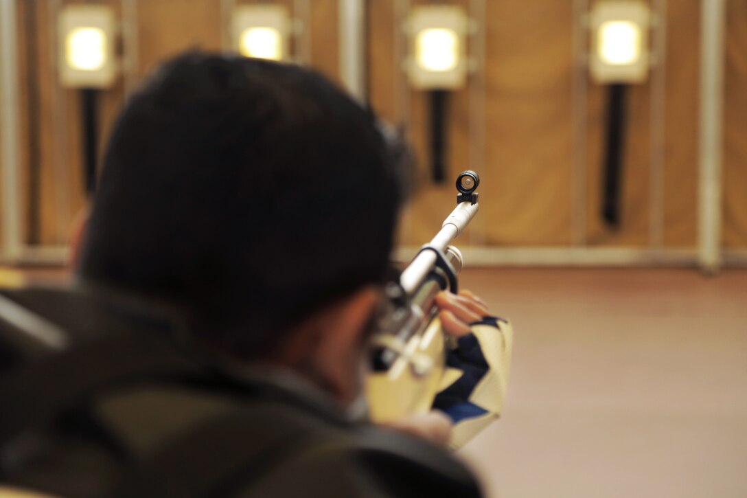 Army Spc. Benny Koshy takes aim during shooting competition at the 2015 Army Trials on Fort Bliss in El Paso, Texas, March 30, 2015. 