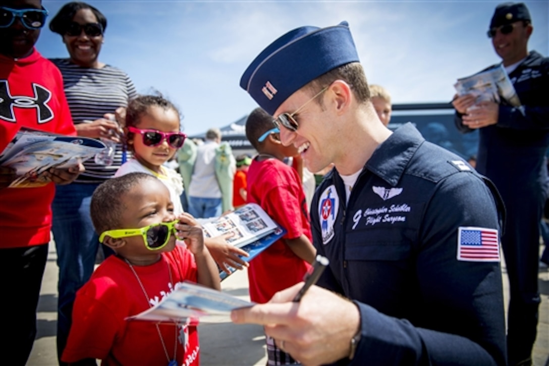 Air Force Capt. Christopher Scheibler, Thunderbird 9, interacts with fans during the Thunder on the Bay Air Show on Keesler Air Force Base, Miss., March 28, 2015. 