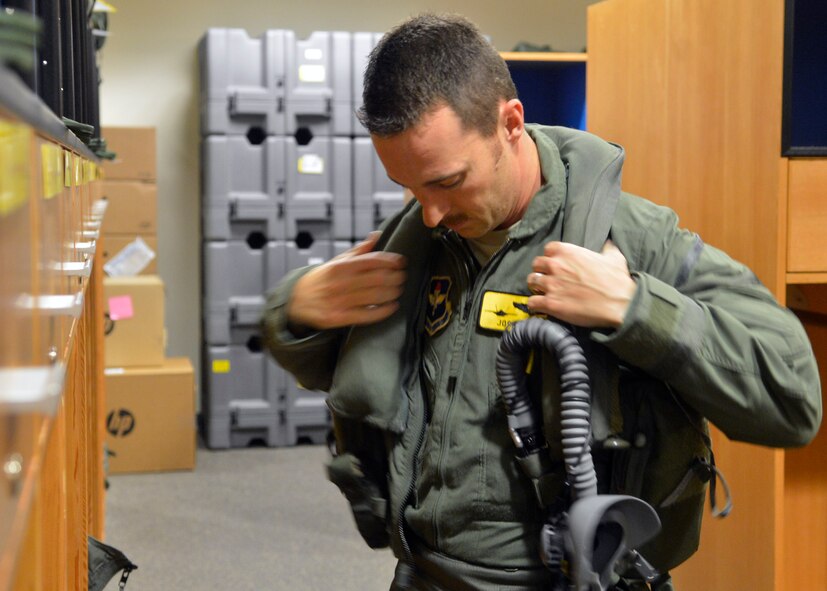 Maj. Joshua Arki prepares to fly the F-35A Lightning II 1,000th training sortie March 31, 2015, at Luke Air Force Base, Arizona. Arki is a pilot with the 61st Fighter Squadron which is part of the 56th Fighter Wing. The wing was the fastest F-35 wing to reach the 1,000-sortie milestone in the Defense Department. (U.S. Air Force photo/Senior Airman Devante Williams)