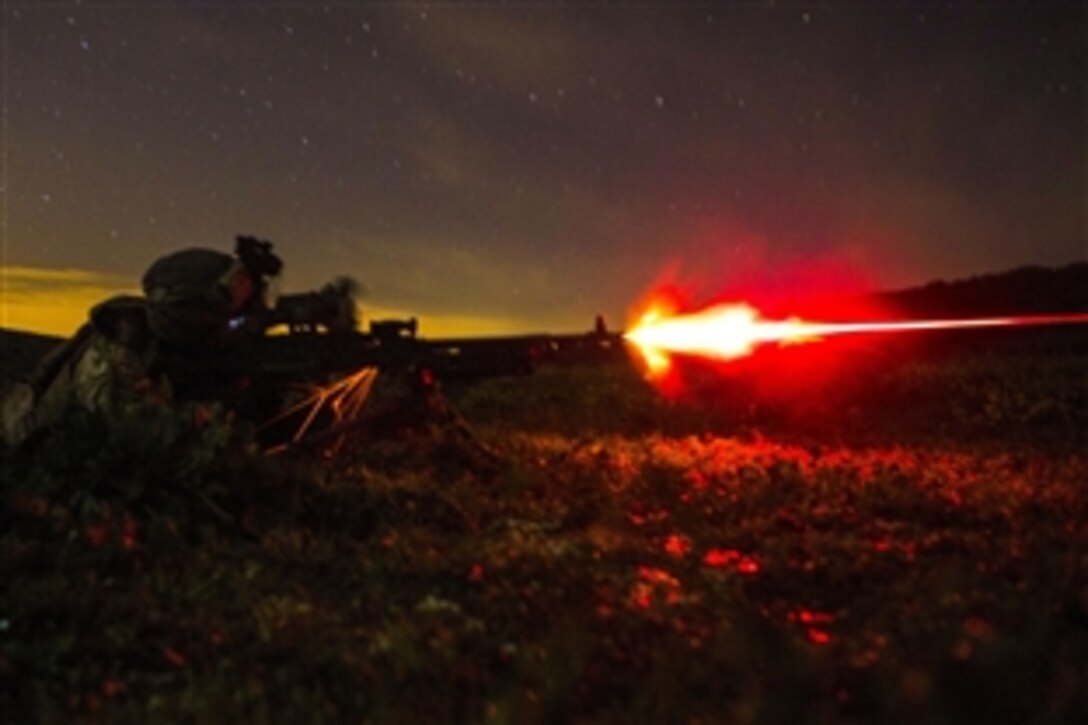 U.S. Marine Corps Lance Cpl. Charles Detz III fires a tracer round from an M240B during a live-fire training exercise in Sierra Del Retin, Spain, March 24, 2015. The Marines, stationed on Moron Air Base in southern Spain, conducted several training missions to maintain their infantryman skills. Detz is a machine gunner assigned to the Special Purpose Marine Air-Ground Task Force Crisis Response Africa.