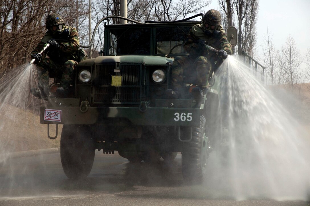 Republic of Korea airmen perform a decontamination operation at Osan Air Base in the Republic of Korea March 19. ROK airmen participated in a chemical, biological, radiological and nuclear joint training exercise with Marine Wing Headquarters Squadron 1 CBRN and 51st Civil Engineer Squadron CBRN. The week-long bilateral training event enabled U.S. Marines and airmen, and ROK airmen to learn different tactics, techniques and procedures. 