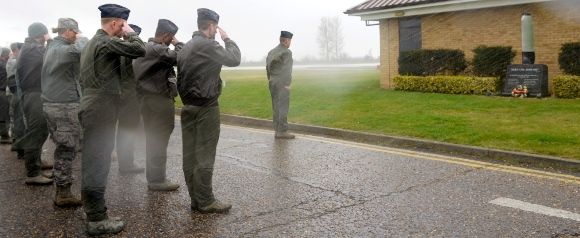 Air Commandos from the 352nd Special Operations Wing render a salute while in formation during a remembrance ceremony at the 7th Special Operations Squadron on RAF Mildenhall, England. The ceremony, held in honor of the 10th anniversary of the nine Airmen who died when WRATH-11, an MC-130H Combat Talon II assigned to the 7th SOS, crashed in Albania on March 31, 2005. The flight was part of a training exercise with two other aircraft to train on low-level and low-light flying. (U.S. Air Force photo by Senior Airman Victoria H. Taylor)