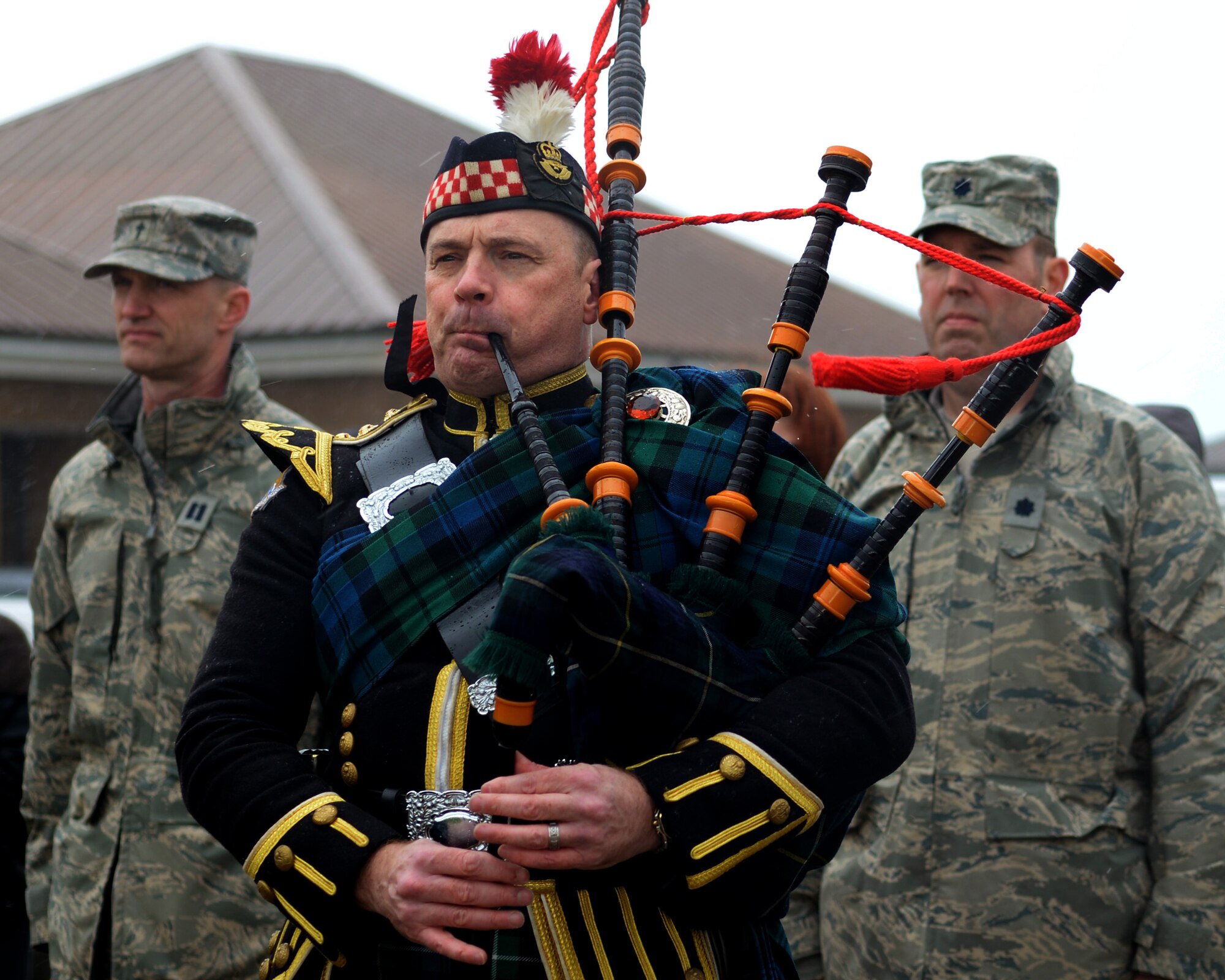 Will Bissett, a bagpiper, plays during the remembrance ceremony March 31, 2015, at the 7th Special Operations Squadron on RAF Mildenhall, England. The ceremony, held in honor of the 10th anniversary of the nine Airmen who died when WRATH-11, an MC-130H Combat Talon II assigned to the 7th SOS, crashed in Albania on March 31, 2005. The flight was part of a training exercise with two other aircraft to train on low-level and low-light flying. Bissett has played for the 7th SOS since the time the unit was stationed at RAF Alconbury. (U.S. Air Force photo by Senior Airman Victoria H. Taylor)
