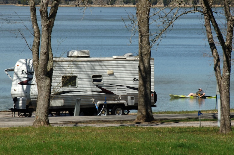 A camper kayaks by a campsite on the shoreline April 1, 2015 at Defeated Creek Campground in Defeated, Tenn.  All 25 of the U.S. Army Corps of Engineers Nashville District campgrounds will be open by May 2015.