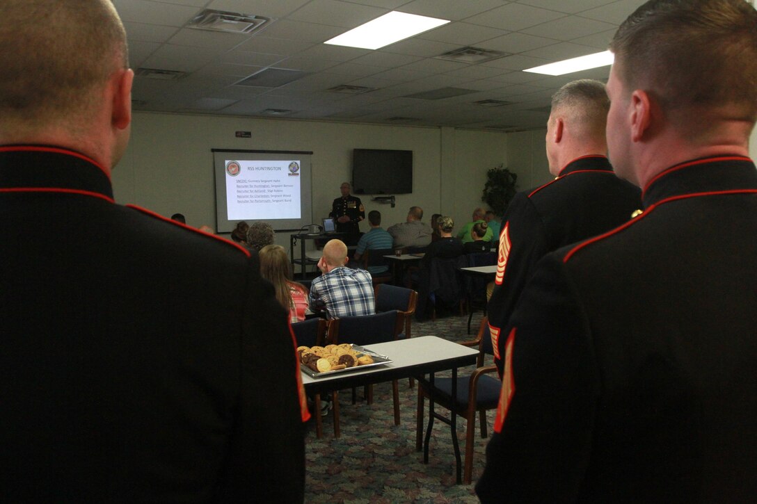 Family members of future Marines listen to a presentation by Recruiting Station Charleston recruiters March 23, 2015, at Marshal University campus, Huntington, West Virginia. The presentation and dinner allowed recruiters to address parents and poolees and answer questions about recruit training aboard Marine Corps Recruit Depot Parris Island, South Carolina. (U.S. Marine Corps photo by Sgt Caitlin Brink/Released)