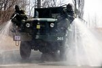 OSAN AIR BASE, Republic of Korea (Mar. 19, 20150) - Republic of Korea (ROK) airmen perform a decontamination operation. ROK airmen participated in a chemical, biological, radiological and nuclear joint training exercise with Marine Wing Headquarters Squadron 1 CBRN and 51st Civil Engineer Squadron CBRN. The week-long bilateral training event enabled U.S. Marines and airmen, and ROK airmen to learn different tactics, techniques and procedures.  