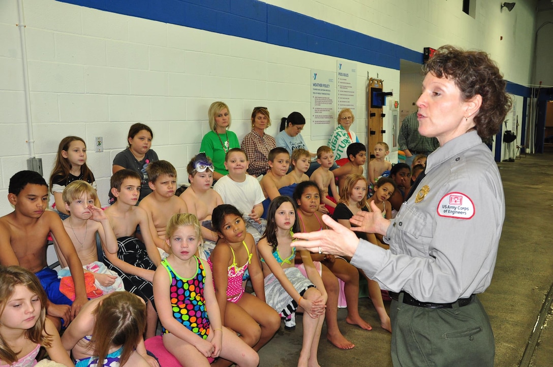 U.S. Army Corps of Engineers Park Ranger Sondra Carmen instructs youth today about lfe jackets and the importance of water safety as part of the Learn to Swim Program at the Putnam County Family YMCA in Cookeville, Tenn.