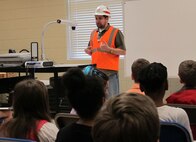U.S. Army Corps of Engineers Huntsville Center project manager Dominic Ragucci explains the importance of wearing safety equipment at project sites.

