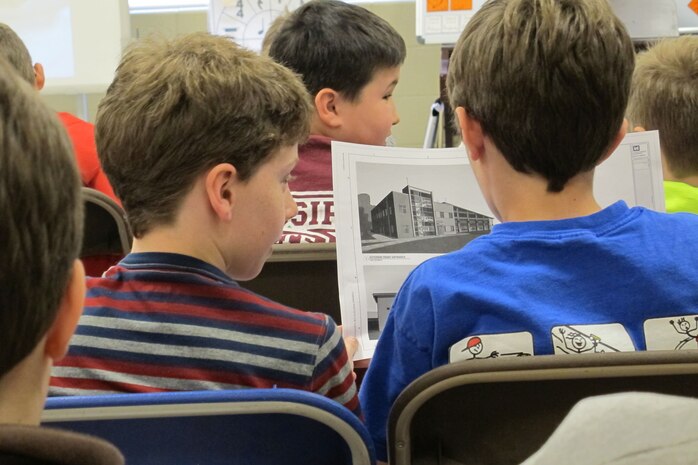 Monte Sano Elementary School students examine project drawings.