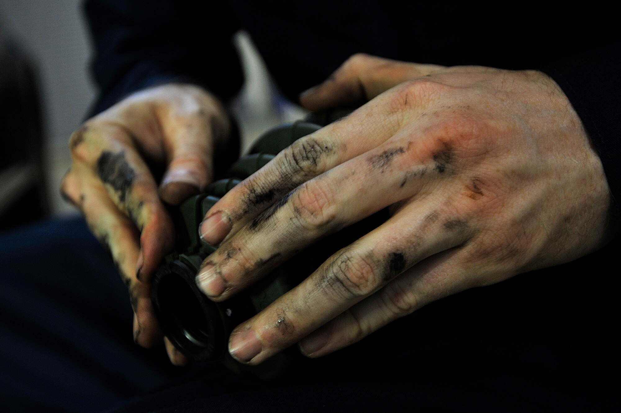 U.S. Air Force Airman 1st Class Bryan Medile, 35th Logistics Readiness Squadron vehicle and vehicular maintenance journeyman, prepares to replace a CV-joint boot on a government vehicle at Misawa Air Base, Japan, April 2, 2015. While the ins and outs of the job of a vehicle maintainer can often get greasy, Airmen and contractors are prepared to do what is necessary to ensure upkeep of all government vehicles at Misawa AB. (U.S. Air Force photo by Senior Airman Jose L. Hernandez-Domitilo/Released)