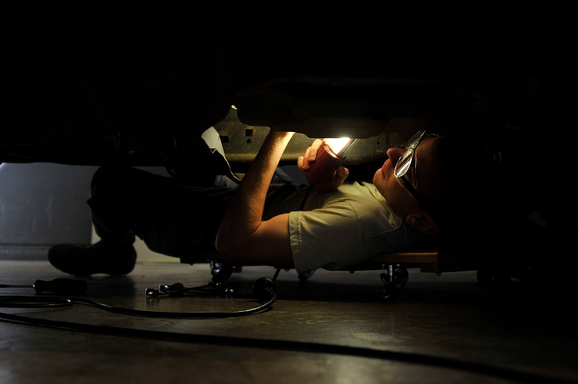 U.S. Air Force Airman 1st Class Thomas Keifman, 35th Logistics Readiness Squadron vehicle and vehicular maintenance journeyman, fixes a shifter bushing on a government vehicle at Misawa Air Base, Japan, March 27, 2015. Whether it’s an ambulance, security forces response vehicle, fire truck, or snow plow, the vehicle maintenance flight ensures each vehicle is back to proper working condition if any mechanical issues arise. (U.S. Air Force photo by Senior Airman Jose L. Hernandez-Domitilo/Released)