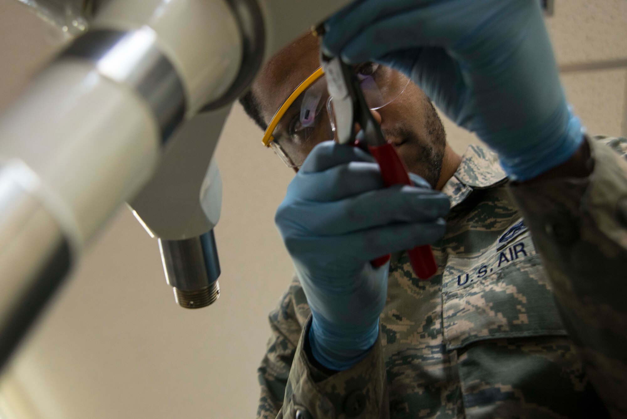 Senior Airman Rodney Shepherd, 35th Maintenance Squadron, repairs a landing gear system for an F-16 Fighting Falcon at Misawa Air Base, Japan, March 31, 2015. Shepherd works in the hydraulics systems back shop, where they maintain F-16 systems including landing gear systems, brakes and flight controls. (U.S. Air Force photo by Staff Sgt. Derek VanHorn/Released)