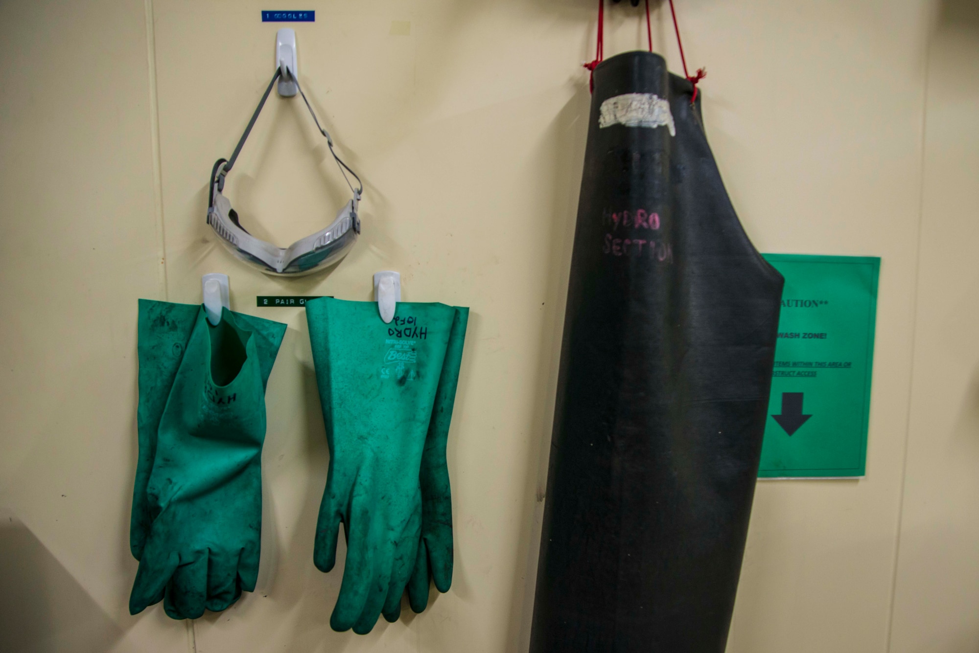 Protective gear used by 35th Maintenance Squadron hydraulic systems maintainers rests on their back shop wall March 31, 2015, at Misawa Air Base, Japan. The hydro shop deals mainly with repairing landing gear and brake systems, which are usually messy jobs. (U.S. Air Force photo by Staff Sgt. Derek VanHorn/Released)
