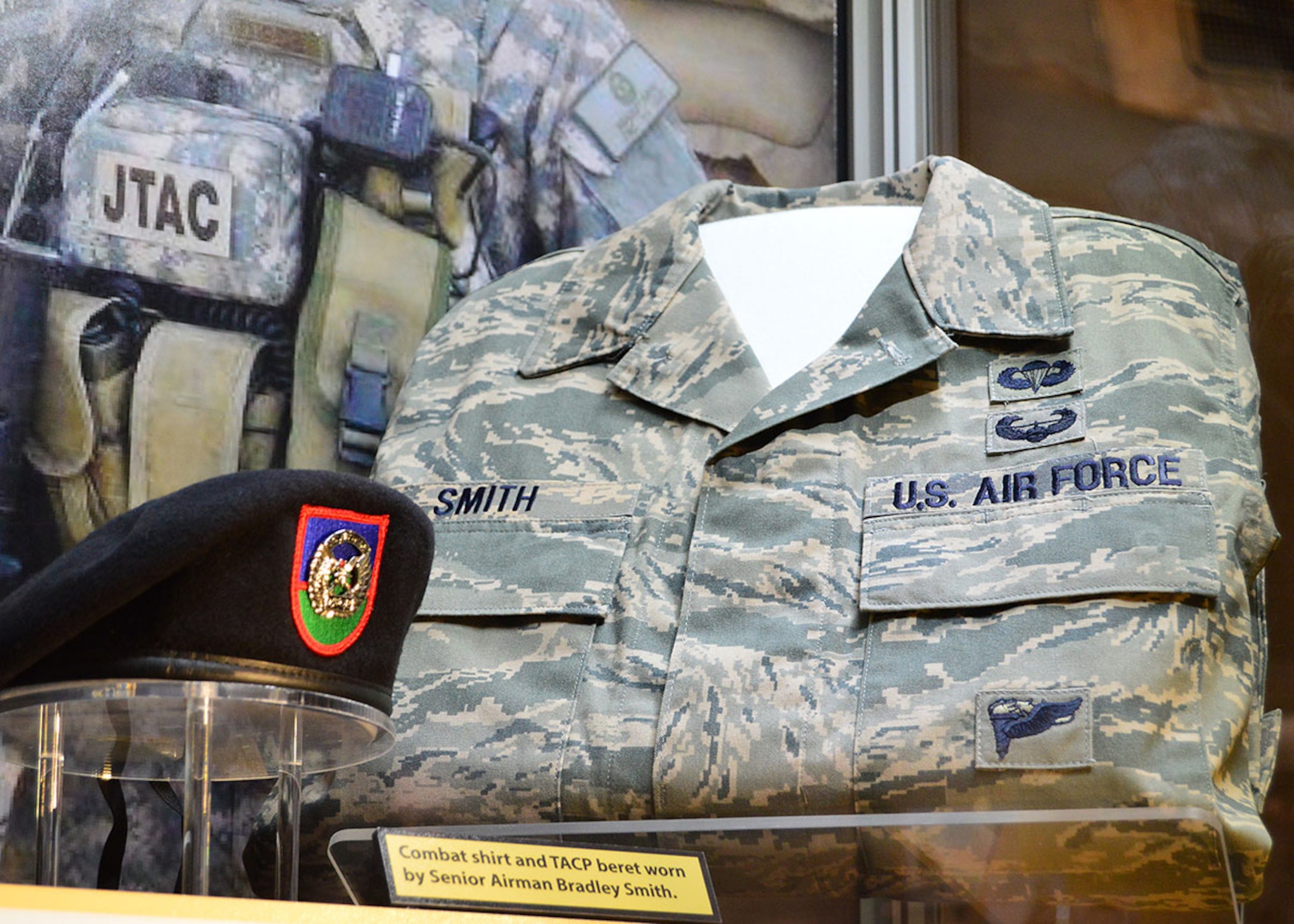 A TACP beret and ABU blouse worn by Senior Airman Bradley Smith is displayed in the “Duty First, Always Ready” exhibit, located in the Cold War Gallery at the National Museum of the U.S. Air Force, highlights the service of Senior Airmen Michael Malarsie and Bradley Smith, a two-man Joint Terminal Attack Controller team who deployed together to Afghanistan in December 2009.  (Courtesy photo)