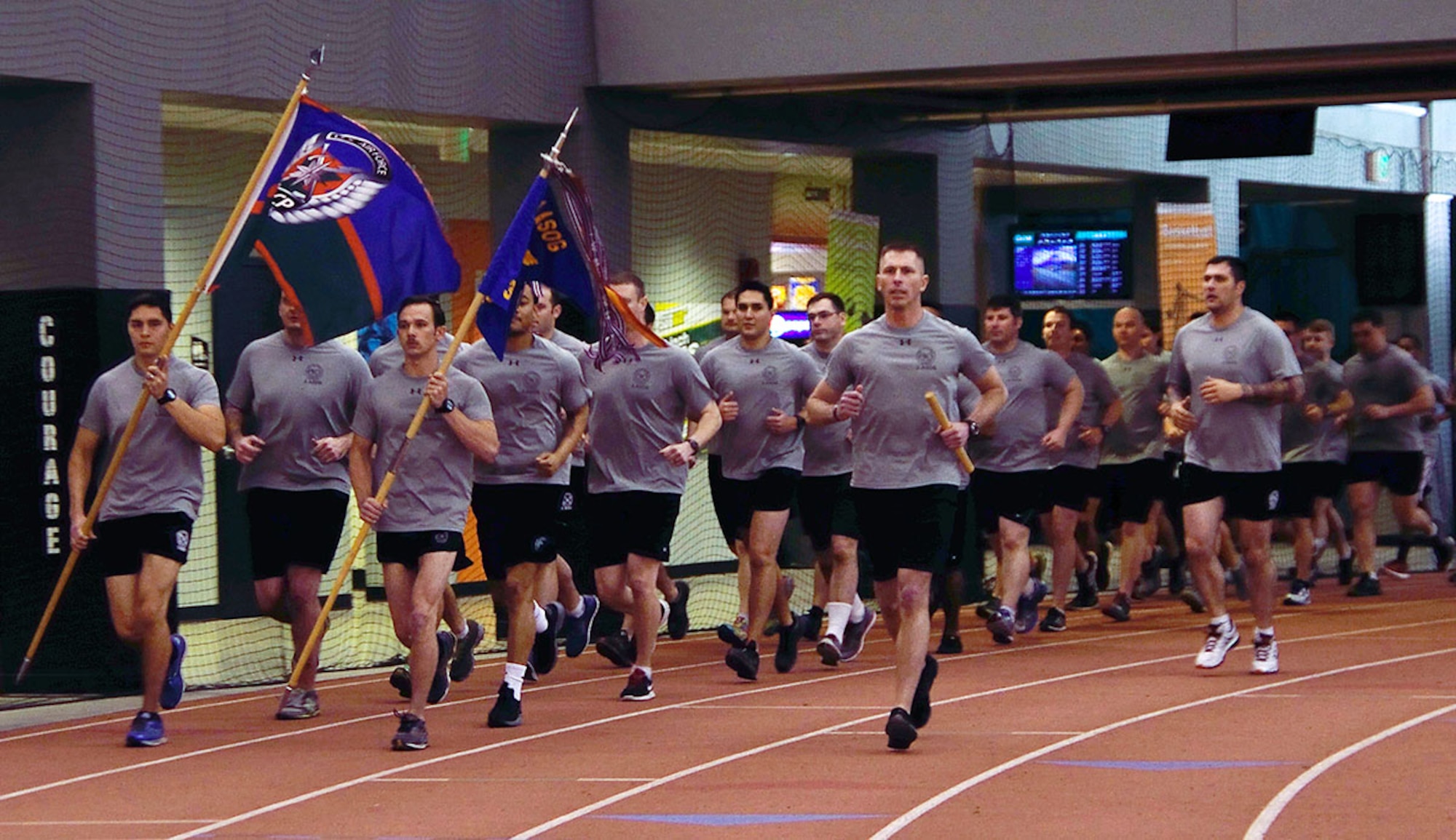 Members of the 3rd Air Operations Support Squadron complete a lap inside the Alaska Dome in Anchorage March 27 during their annual 24-hour run challenge. The challenge is a worldwide competition to see how many miles the TACPs can run and also to ensure those who made the ultimate sacrifice are never forgotten. (U.S. Air Force photo/Staff Sgt. Sheila deVera)